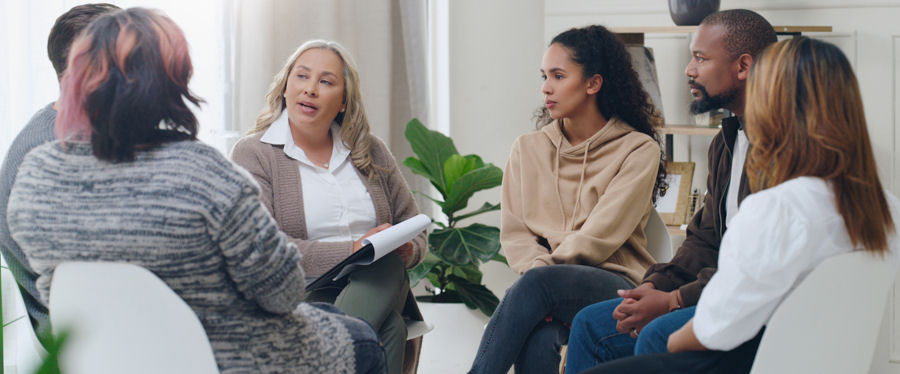 small group sitting in chairs for therapy