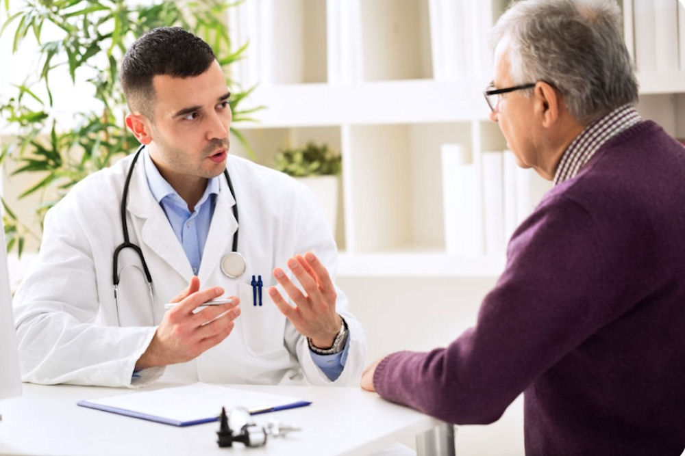 a doctor speaking to a senior
