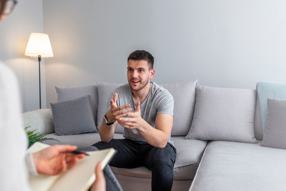 party-drugs-addiction-treatment a man with addiction problem consulting a therapist in Huntington Beach