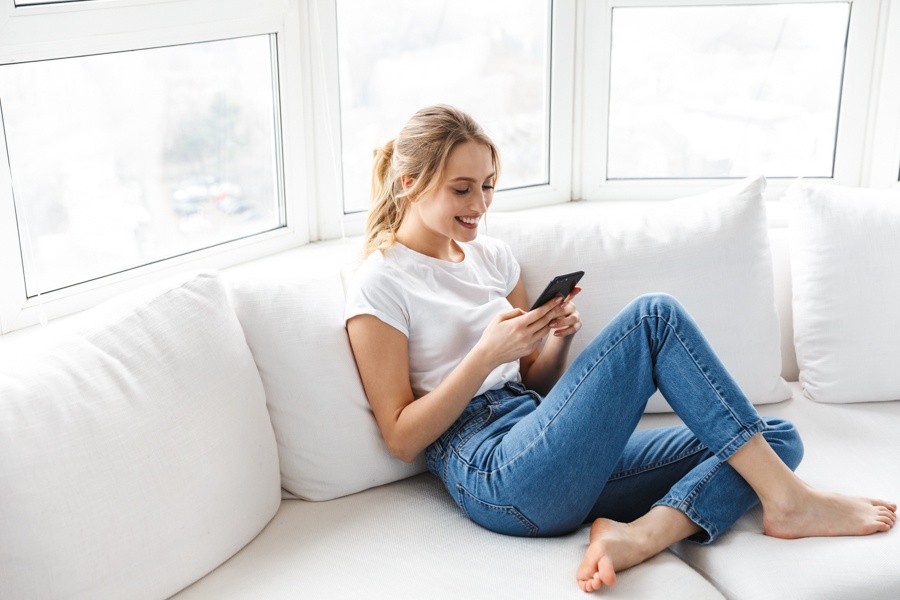 a woman checking her checklist on what to bring to detox
